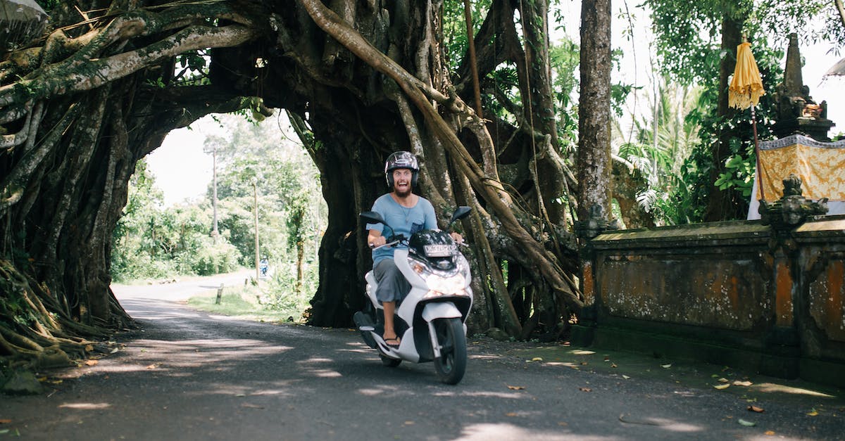 man on motorcycle with Bali drivers license 
