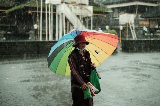 Bali October weather woman with umbrella